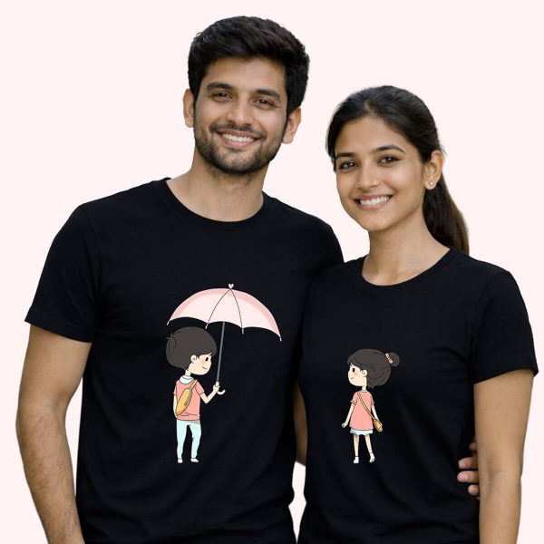 Tender boy sharing his umbrella black - the only couple